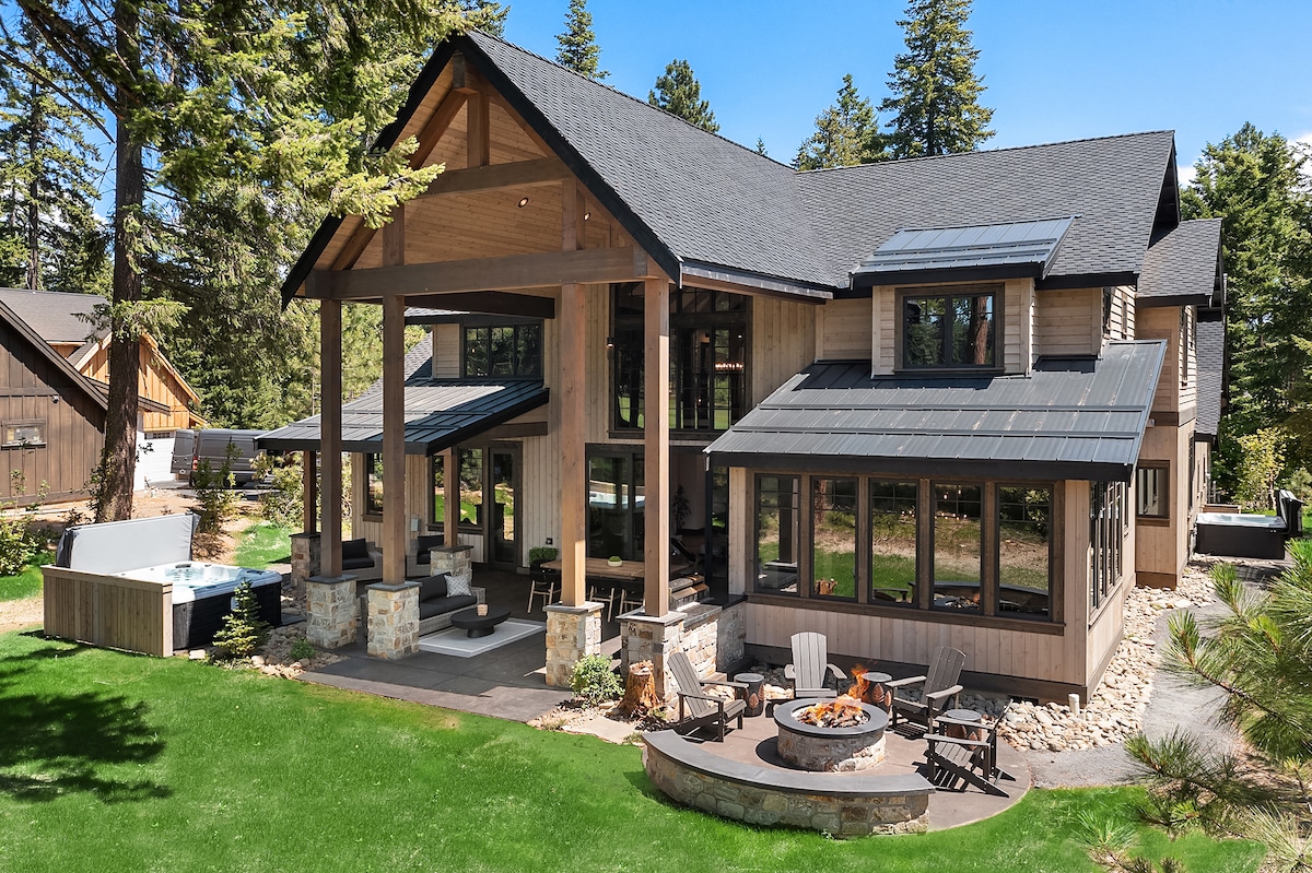 Suncadia Spa Lodge exterior with covered deck, hot tub, and fire pit