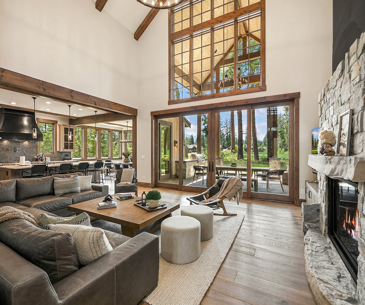 Open-concept great room with soaring 30-foot ceilings and fireplace